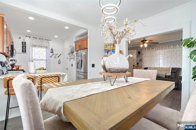 dining room with ceiling fan and light wood-type flooring