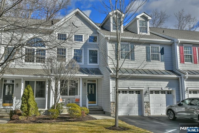 townhome / multi-family property featuring a garage