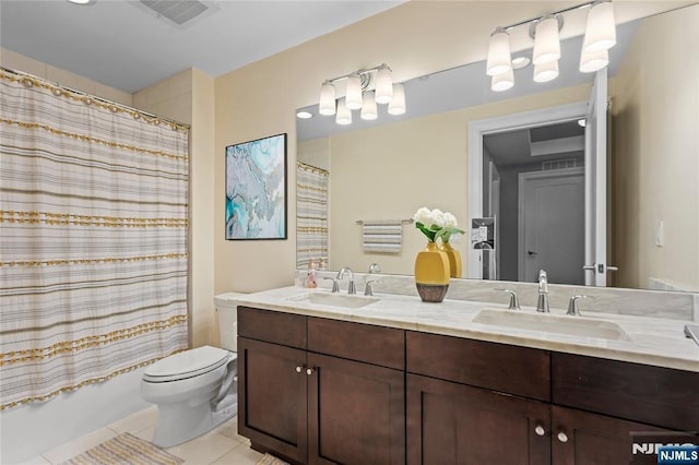 full bathroom featuring tile patterned flooring, vanity, toilet, and shower / tub combo with curtain