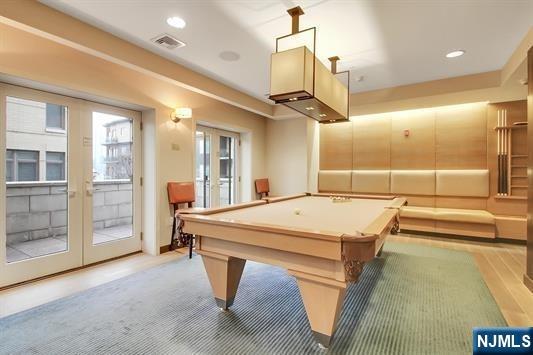 rec room featuring billiards and french doors