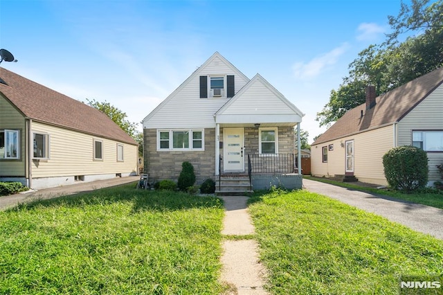 bungalow-style house featuring a front yard