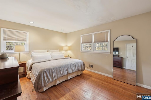 bedroom with light wood-type flooring