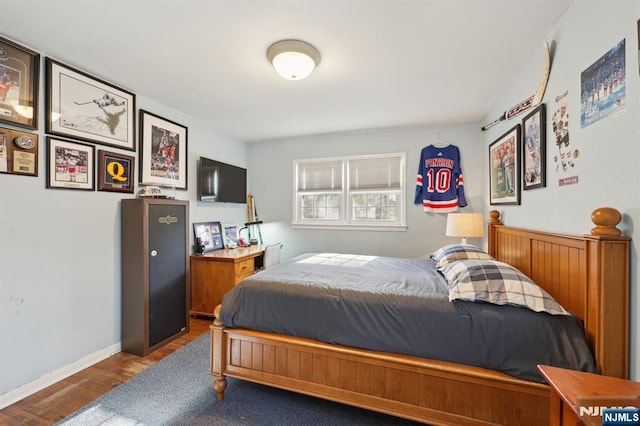 bedroom with wood-type flooring