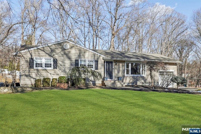 ranch-style home with a front lawn