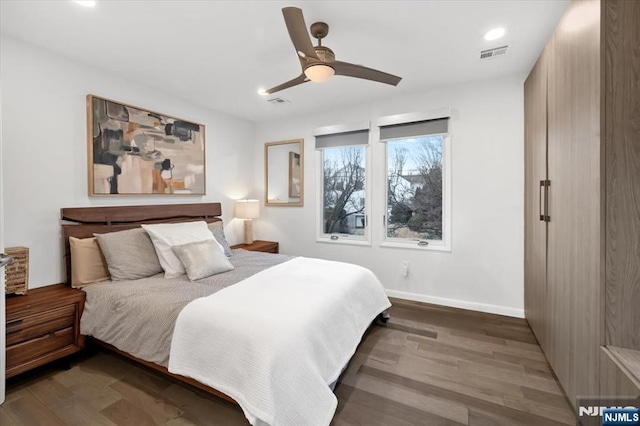 bedroom featuring hardwood / wood-style floors and ceiling fan