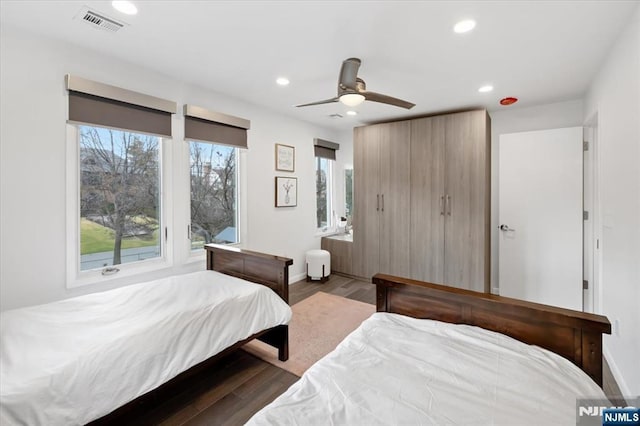 bedroom featuring dark hardwood / wood-style flooring and ceiling fan