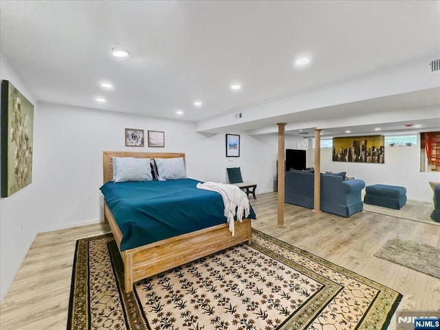 bedroom with hardwood / wood-style flooring