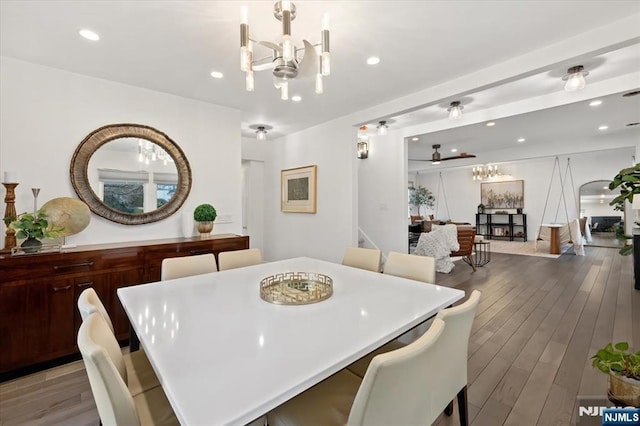 dining space featuring an inviting chandelier and hardwood / wood-style floors