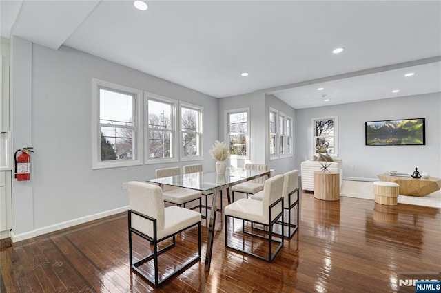 dining space featuring dark hardwood / wood-style floors