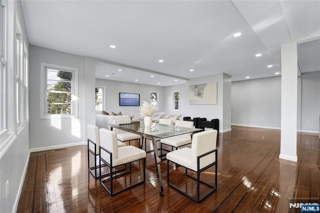 dining space featuring dark hardwood / wood-style floors