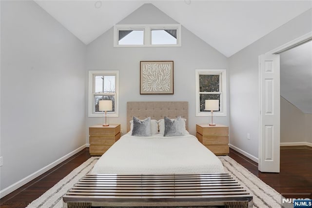 bedroom with dark wood-type flooring and high vaulted ceiling