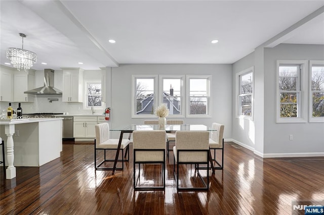 dining room featuring dark wood-type flooring and a notable chandelier