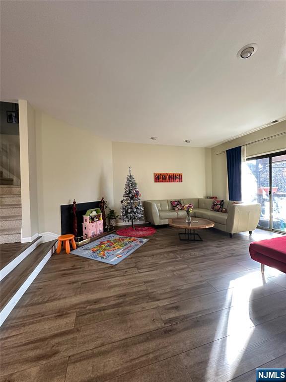 living room featuring dark wood-type flooring