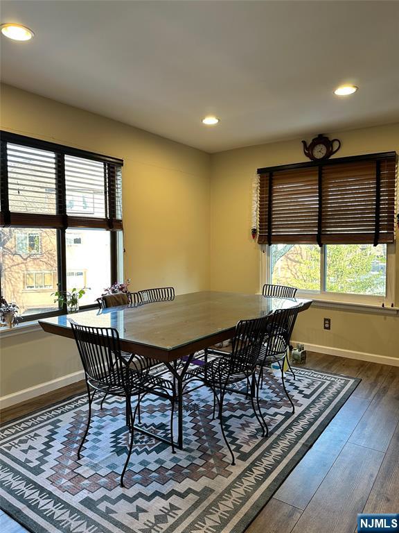 dining room with hardwood / wood-style floors