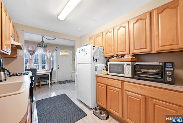 kitchen featuring a baseboard heating unit, white appliances, light countertops, and under cabinet range hood