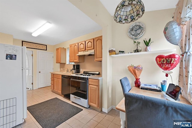 kitchen featuring light brown cabinets, under cabinet range hood, white appliances, light countertops, and decorative light fixtures