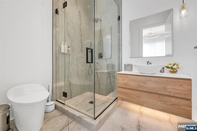 bathroom with vanity, toilet, and an enclosed shower
