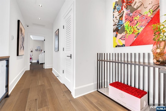 corridor featuring hardwood / wood-style floors