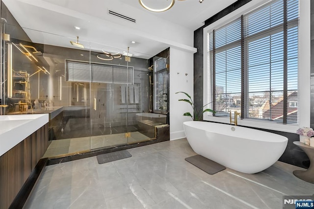 bathroom with plus walk in shower and vanity