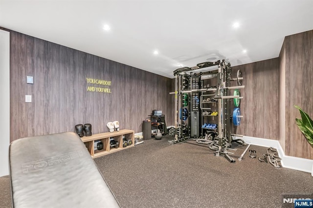 workout room with wooden walls