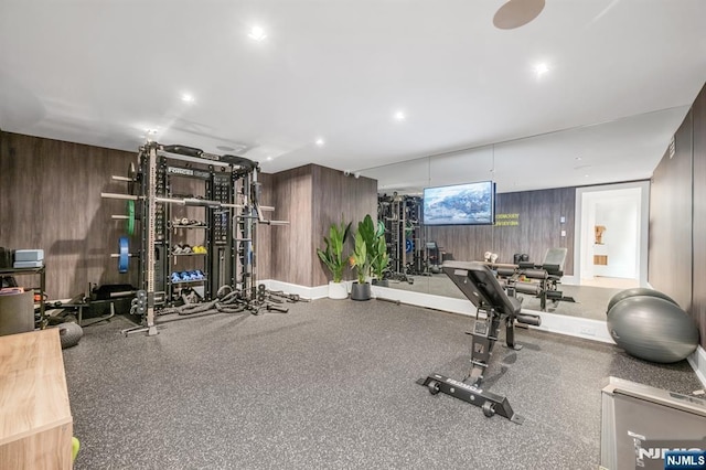 workout area with wood walls