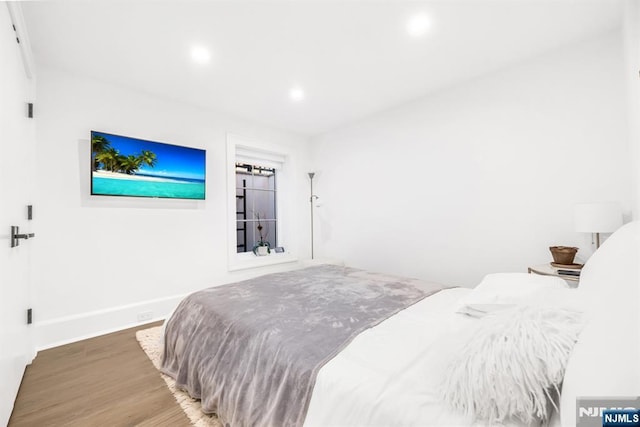 bedroom featuring hardwood / wood-style floors