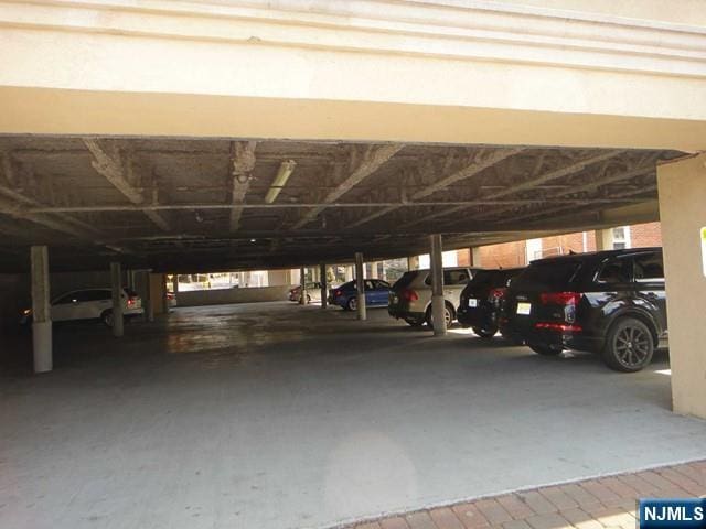 garage featuring a carport