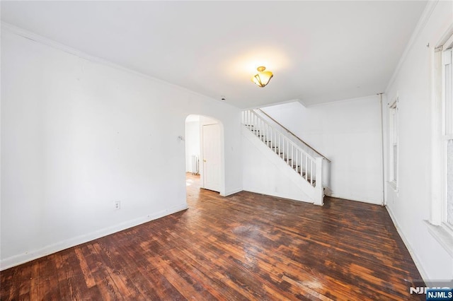 unfurnished living room featuring dark wood-type flooring