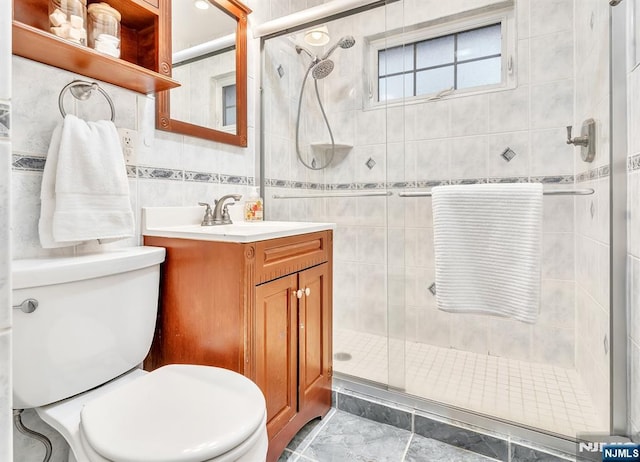 bathroom featuring vanity, toilet, and walk in shower