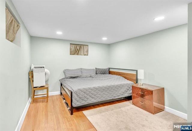 bedroom with light hardwood / wood-style floors