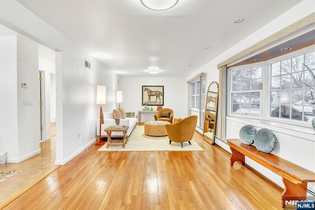 sitting room featuring light hardwood / wood-style floors