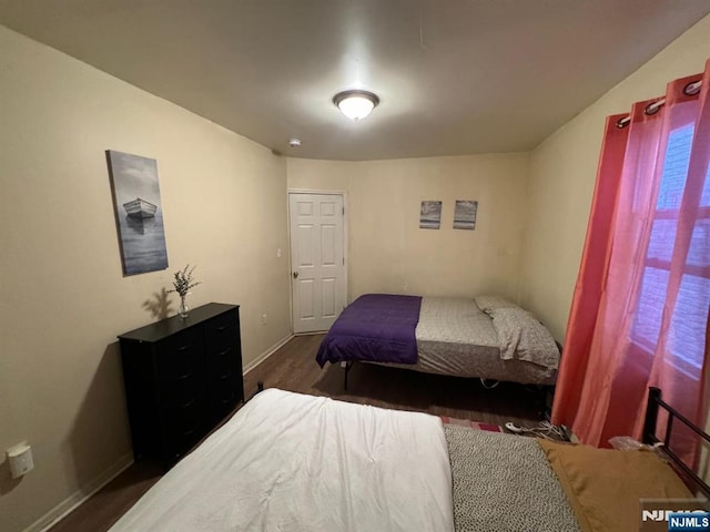 bedroom featuring dark hardwood / wood-style floors