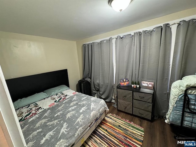 bedroom featuring dark hardwood / wood-style floors