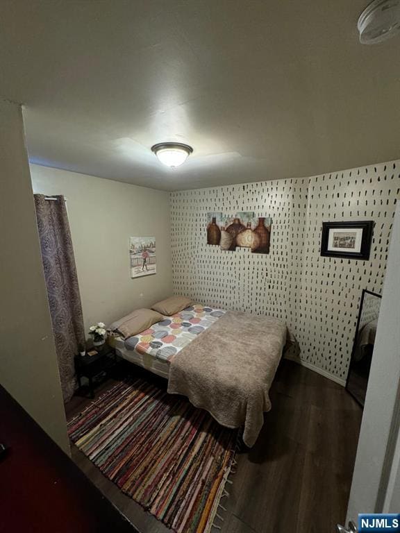 bedroom featuring dark hardwood / wood-style floors