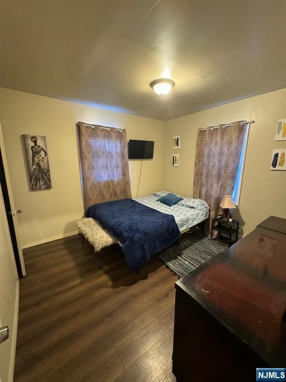 bedroom featuring dark hardwood / wood-style floors