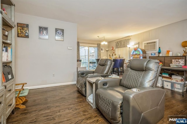 living area featuring a wall mounted air conditioner and dark hardwood / wood-style floors