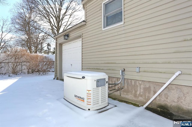 view of snow covered garage