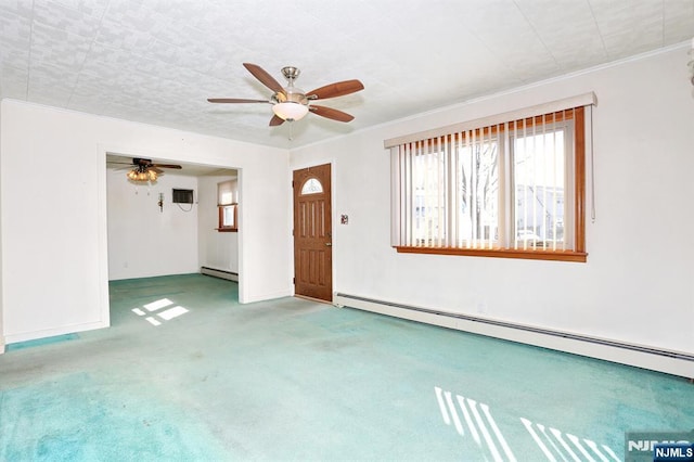 interior space featuring a baseboard radiator, ornamental molding, ceiling fan, and carpet flooring