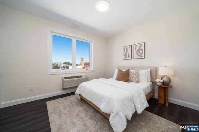 bedroom featuring dark wood-type flooring and a wall mounted AC