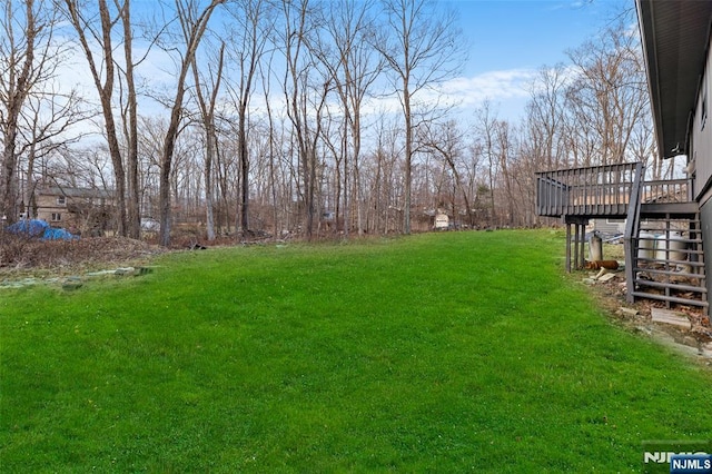 view of yard with a wooden deck