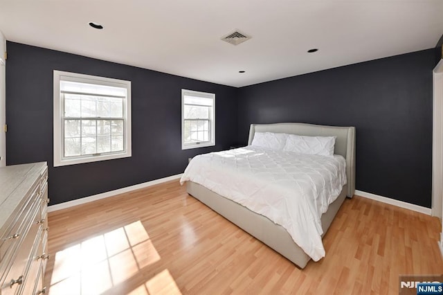 bedroom with light hardwood / wood-style floors