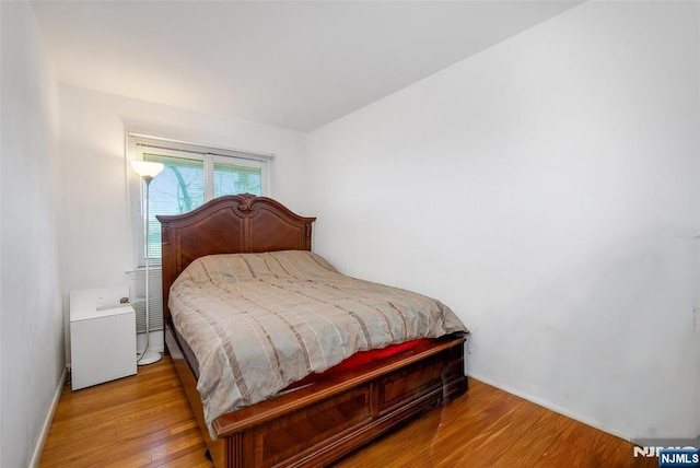 bedroom featuring wood finished floors