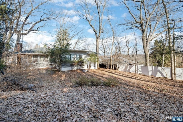 view of front of house with fence