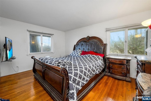 bedroom featuring wood finished floors