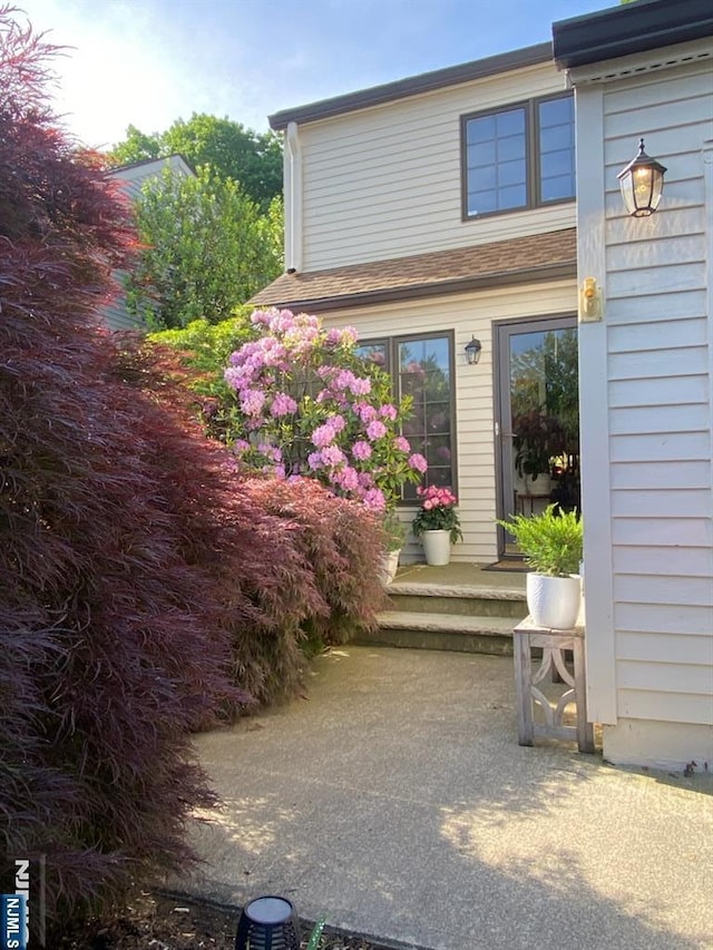 property entrance with a patio