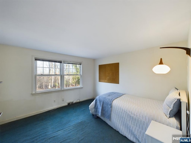 bedroom with dark carpet