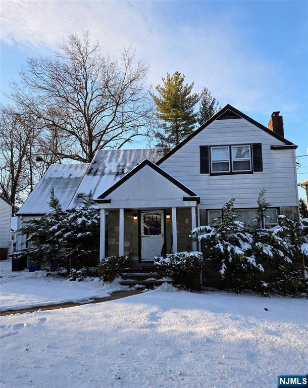 view of front of property featuring a chimney