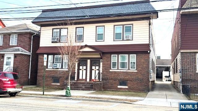 view of front of property featuring brick siding