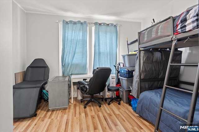 bedroom with light hardwood / wood-style floors