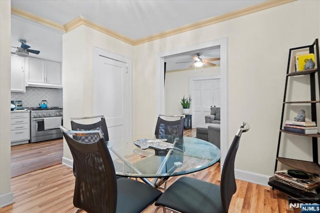 dining area featuring crown molding, ceiling fan, and light wood-type flooring